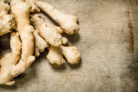 Fresh ginger. On the wooden backgroundの写真素材