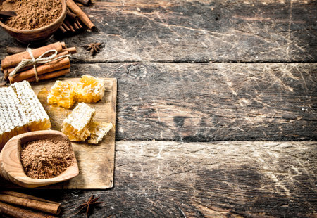 Fresh honey with cinnamon. On wooden background.の写真素材