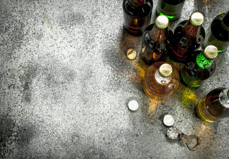 Different bottles of beer. On a rustic background.の写真素材