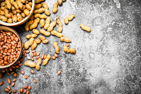 Peanuts in a bowl. On rustic background.の写真素材