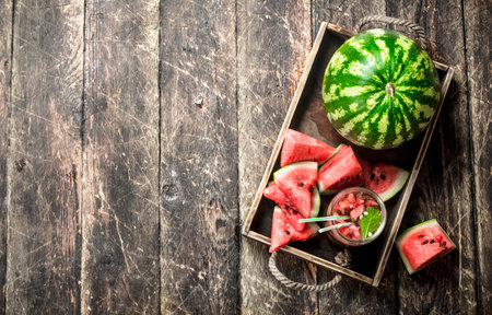 Fresh watermelon juice. On a wooden background.の写真素材