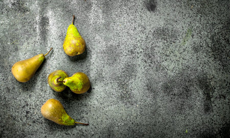 Ripe fresh pears. On a rustic background.