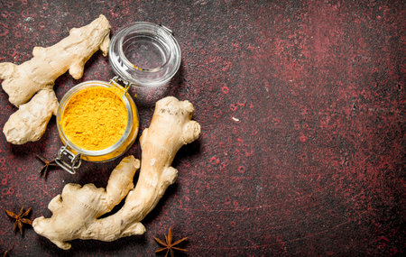 Ground ginger. On the rustic background