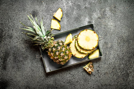 Ripe pineapples. On rustic background. Top view