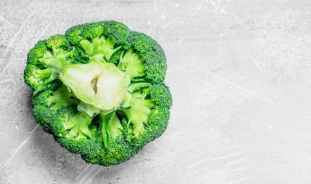 Ripe juicy broccoli. On rustic backgroundの写真素材