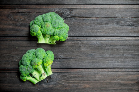 fresh green broccoli. On a wooden background.の写真素材