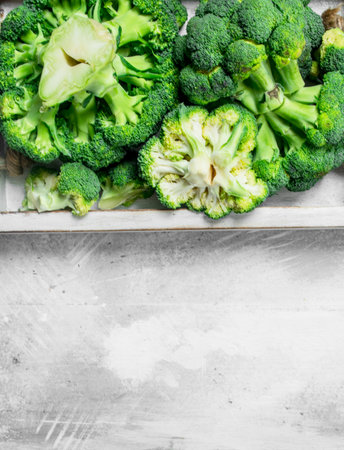 Broccoli on tray. On rustic background