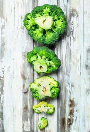 Lots of fresh broccoli. On a wooden background.の写真素材