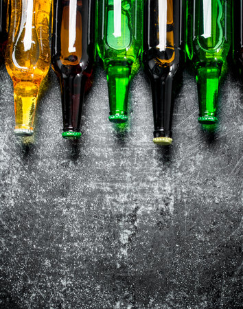Closed beer bottles. On rustic backgroundの写真素材