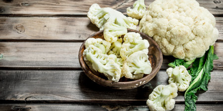 Cabbage in a wooden bowl. On a wooden background.の写真素材