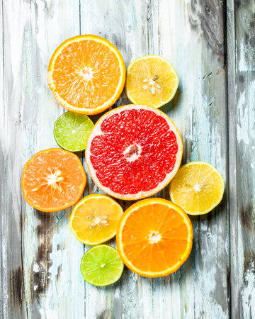 Fresh bright citrus. On white wooden backgroundの写真素材