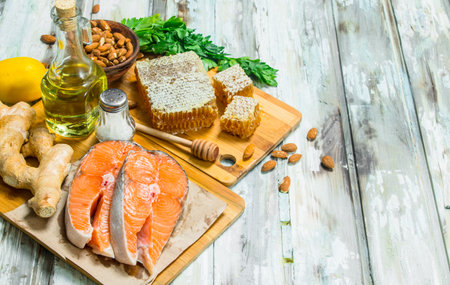 Health food. Salmon with honey, nuts and vegetables. On a rustic background.の写真素材