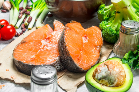 organic food. Raw salmon fish with healthy food. On a rustic background.の写真素材