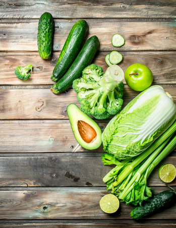 green food. Organic fruits and vegetables. On a wooden backgroundの写真素材