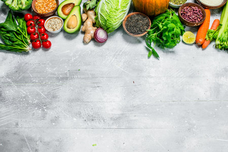 organic food. Healthy vegetables and fruits with legumes. On a rustic background.の写真素材