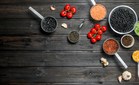 organic food. Ripe healthy vegetables with legumes. On a wooden background.