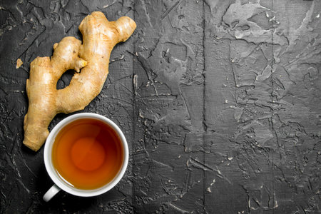 Tea and fresh ginger. On rustic backgroundの写真素材