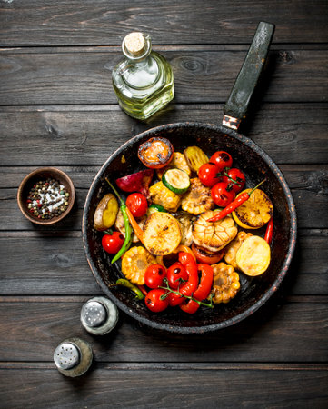 Grilled vegetables in a pan. On a wooden background.の写真素材