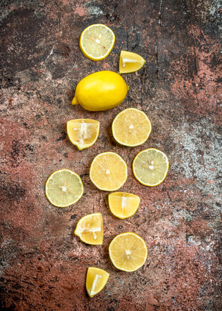 Pieces of fresh lemon. On rustic backgroundの写真素材