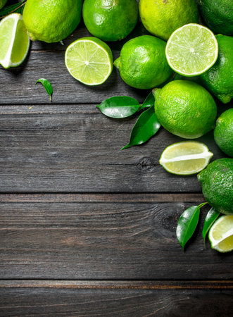 Fragrant green lime. On wooden backgroundの写真素材