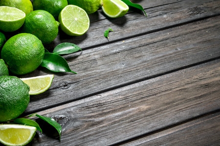 Fragrant green lime. On wooden backgroundの写真素材