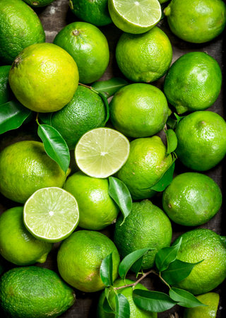 Fresh juicy lime with leaves. top viewの写真素材