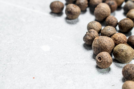 Peas of Fragrant Peppers. On white rustic backgroundの写真素材