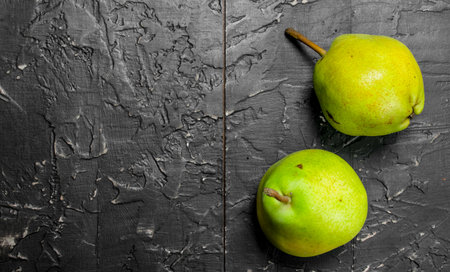 Whole fresh pear. On rustic backgroundの写真素材