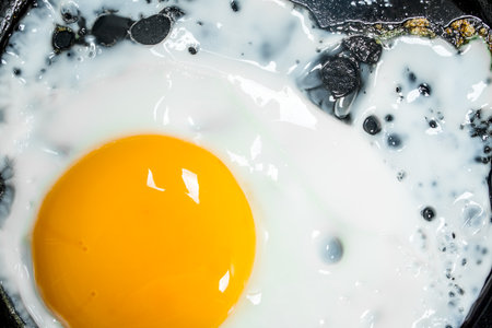 Fried egg in a frying pan. top view.の写真素材