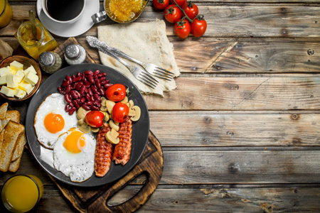 traditional English breakfast. Snacks with fresh coffee. On a wooden background.の写真素材