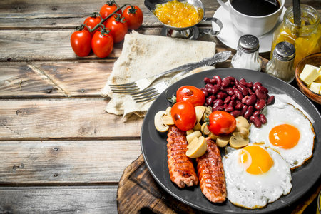 traditional English breakfast. Snacks with fresh coffee. On a wooden background.の写真素材
