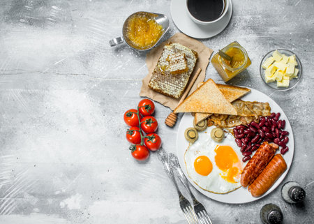 English breakfast. A variety of snacks with aromatic coffee. On a rustic background.の写真素材