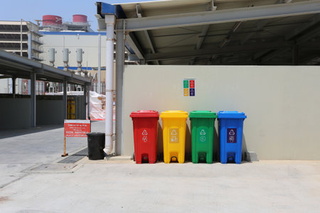 Garbage can Separation of waste. Disposal refuse rubbish bin. Different Colored wheelie basket set. Sorting and recycling of organic, plastic, paper, metal and glass waste and trash management conceptの写真素材