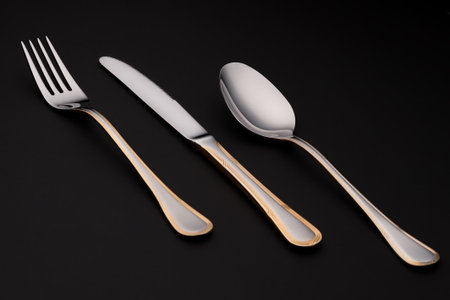 metal cutlery on black backgroundの写真素材