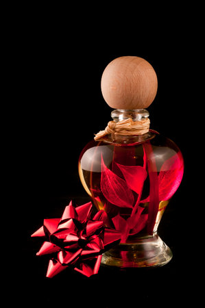 red perfume on black backgroundの写真素材