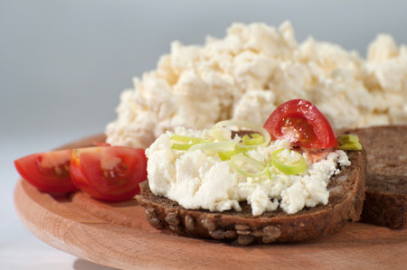 cheese spread on bread with potatoの写真素材