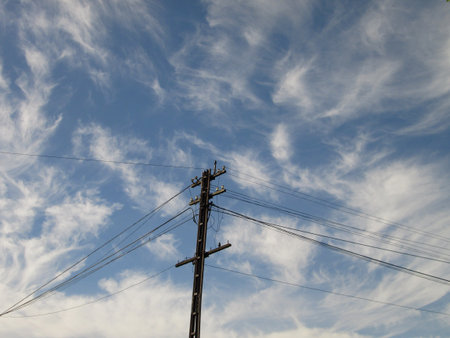 Electricity pylon against the blue skyの写真素材