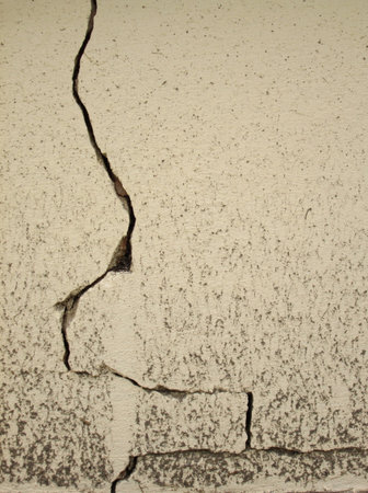 clacked cement of yellow wall