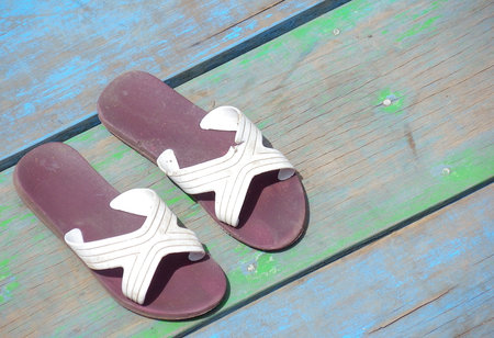 Slippers on a wooden floorの写真素材