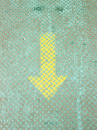 Yellow Arrow paint on steel plate