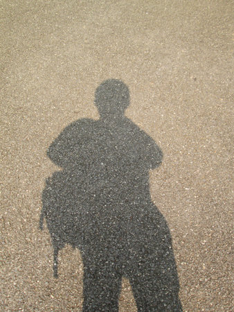 Shadow people on the roadの写真素材