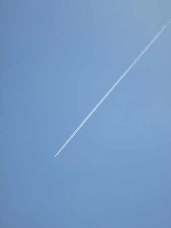 Jet of airplane in the blue sky