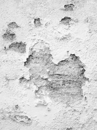 grey cracked plaster wallsの写真素材