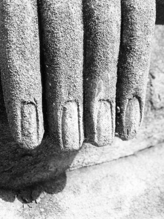 Buddha stone sculpture handsの写真素材