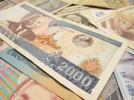 A collection of various currencies from countries spanning the globeの写真素材