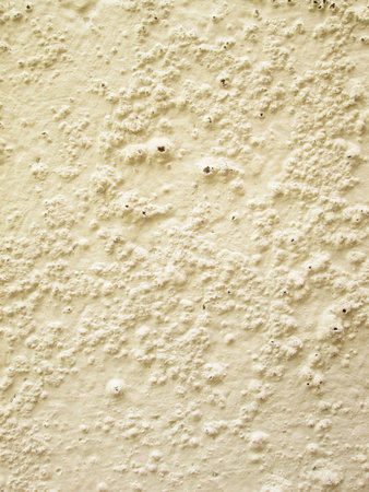 Yellow rough cement wallの写真素材
