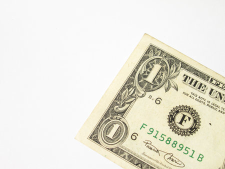 Isolated one dollar banknotes on a white background, featuring a portrait of President George...