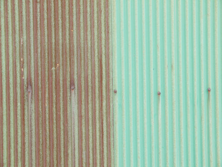 Rusty green painted metal wall with cracked paint, texture colorの写真素材