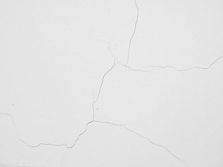 Cracked concrete wall backgroundの写真素材