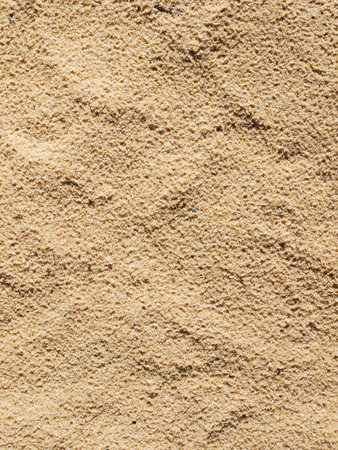 closeup of sand pattern of a beach in the summer